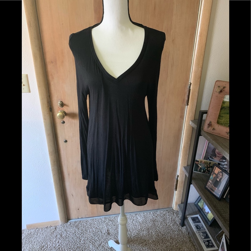 Size XL black top with sheer at hem.